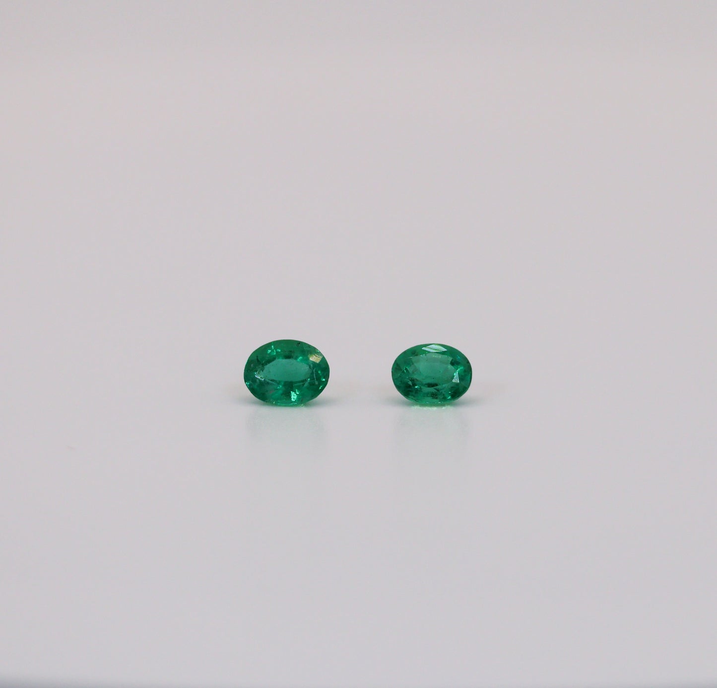 Emeralds Match Pair Oval Shape .78cts total - Columbian