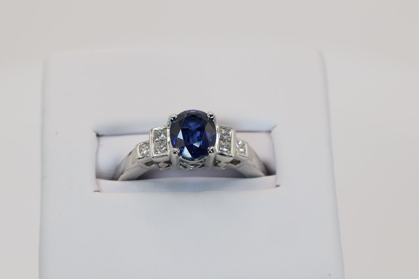 Oval Sapphire Ring with Step-Down Diamond Accents